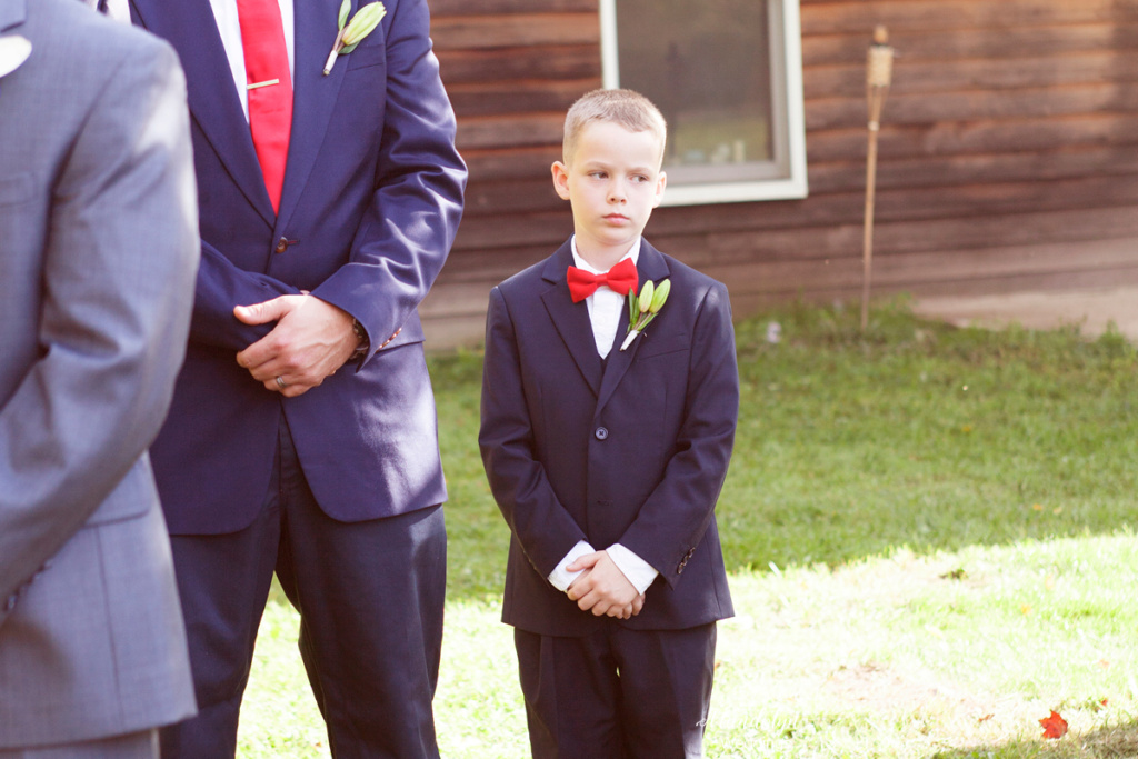 The groomsmen stand at attention. 