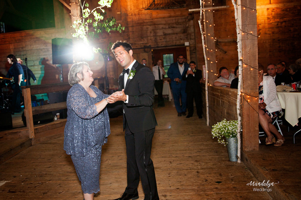 Mother and groom dance. 